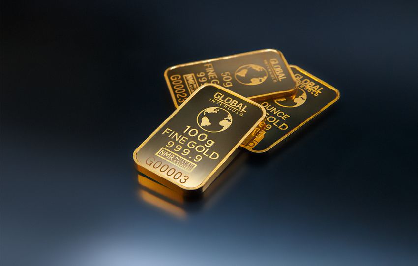 Close-up of gold bars on a dark background, representing wealth and investment opportunities.