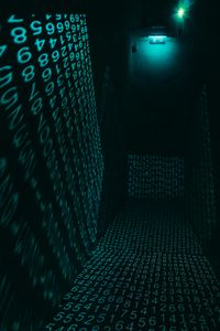A dark hallway illuminated with neon digital number projections, creating a cyberpunk ambiance.