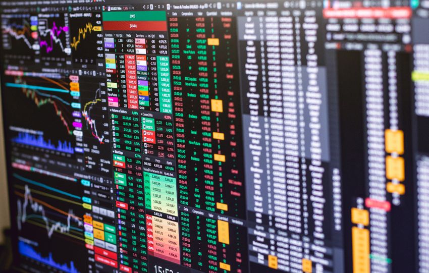 Detailed financial trading screen with colorful charts and data representing market fluctuations.