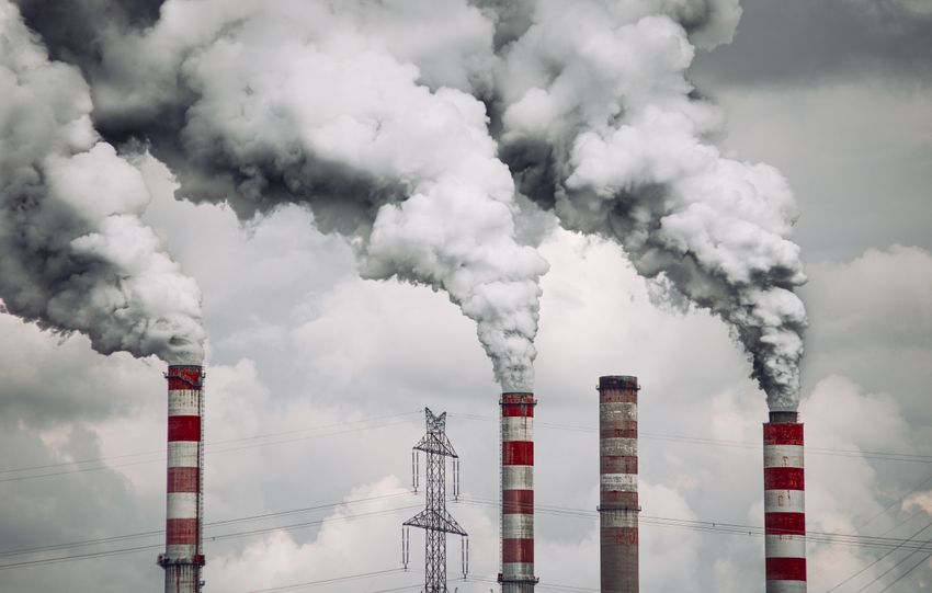 Smoke billows from factory chimneys in Konin, Poland, highlighting pollution and environmental impact.