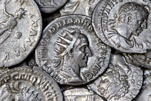 Close-up view of ancient Roman silver coins showcasing detailed engravings and historical significance.