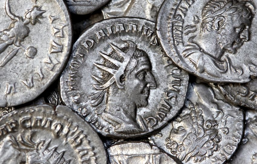 Close-up view of ancient Roman silver coins showcasing detailed engravings and historical significance.