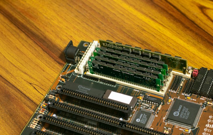 Detailed image of a vintage computer motherboard with RAM sticks.
