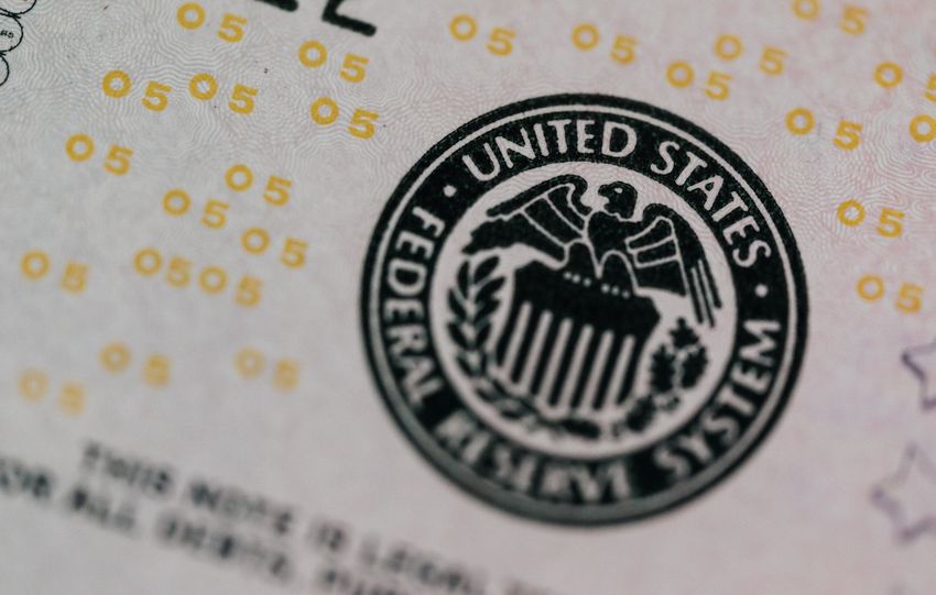 From above eagle on antique column in circle on banknote of Unites States placed on table