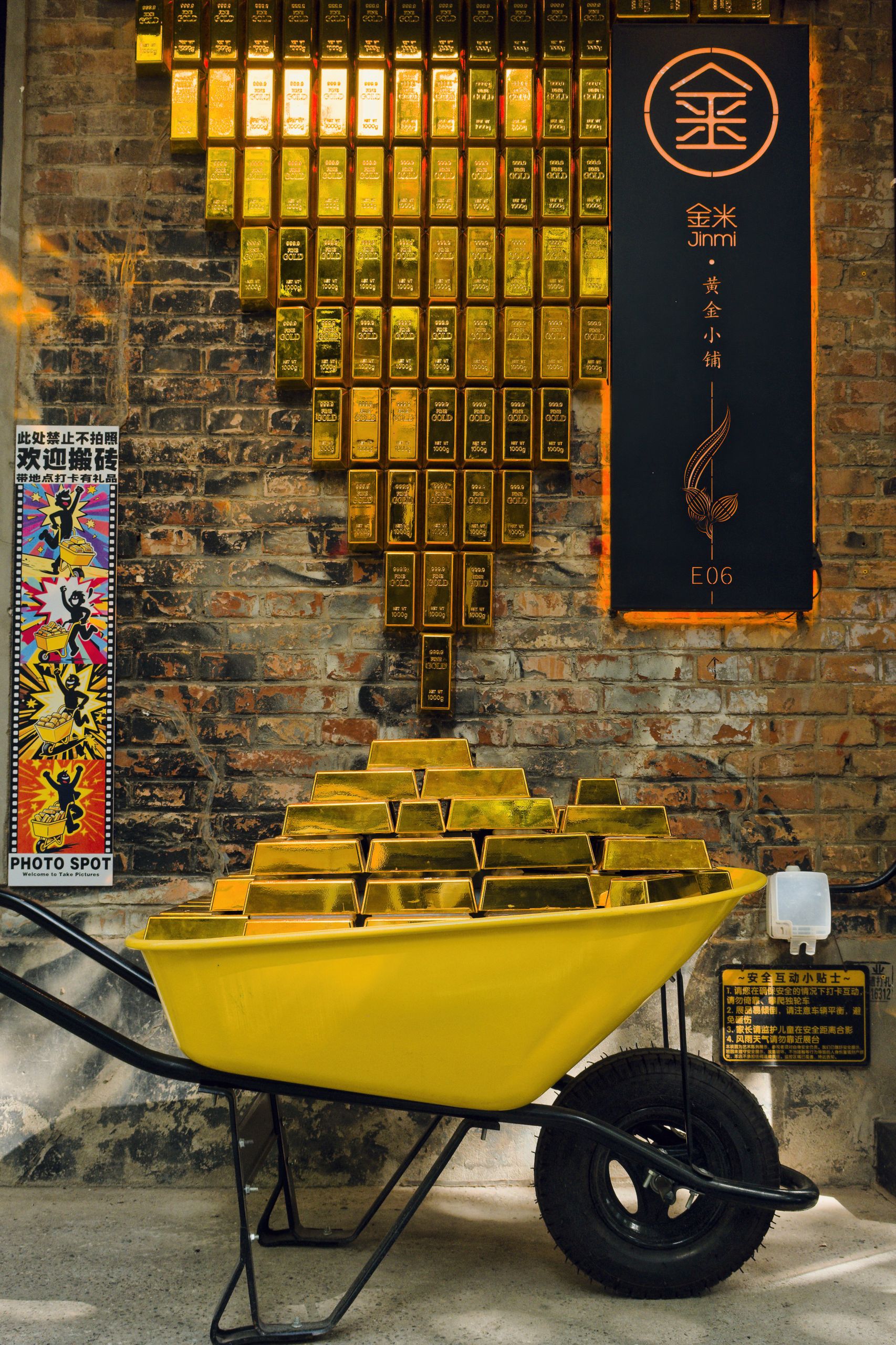 Vibrant gold bar display in a wheelbarrow on a Beijing street, capturing the urban charm.