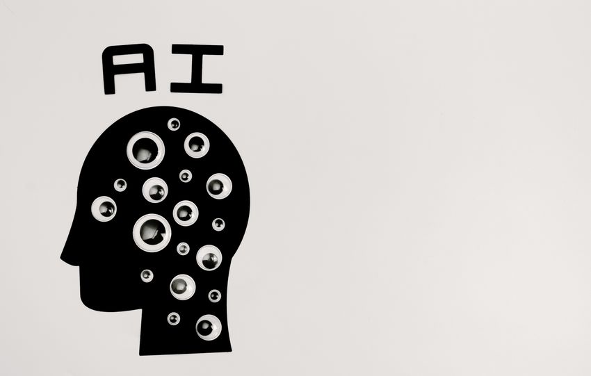 Abstract illustration of AI with silhouette head full of eyes, symbolizing observation and technology.