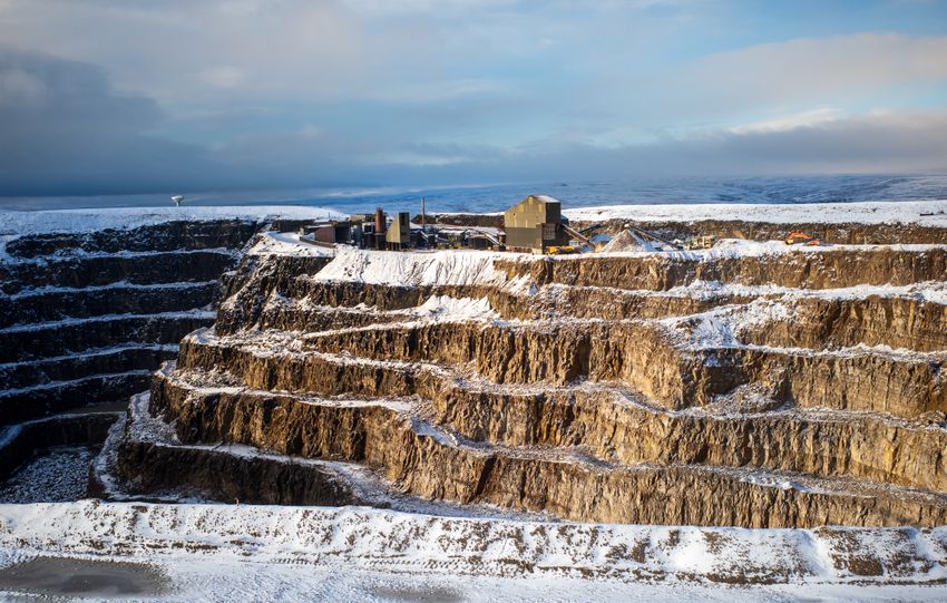 Aerial view of a snow-covered quarry in Bewerley, North Yorkshire, England during winter.