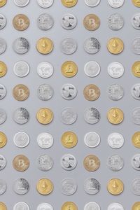 Flat lay of various cryptocurrency coins on white background, showcasing digital currency concept.
