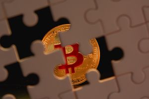 A bitcoin coin partially obscured by puzzle pieces, symbolizing the complexity and mystery of cryptocurrency.