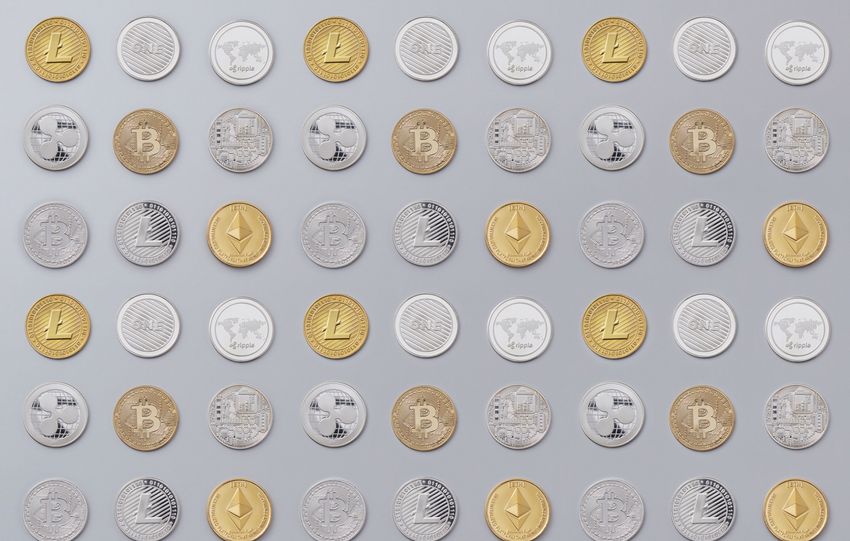 A seamless pattern of various cryptocurrency coins in gold and silver tones.