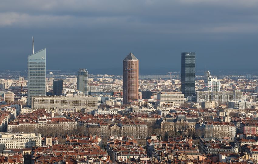 Aerial view of Lyon's skyline featuring modern skyscrapers and urban architecture.