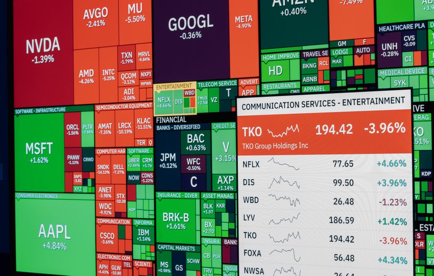 Colorful stock market board displaying various company stock performances and trends.