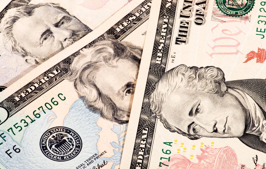 Detailed close-up shot of US dollar bills showing various denominations.