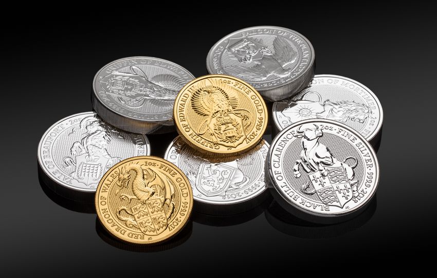 Close-up of valuable gold and silver coins showcasing intricate designs.