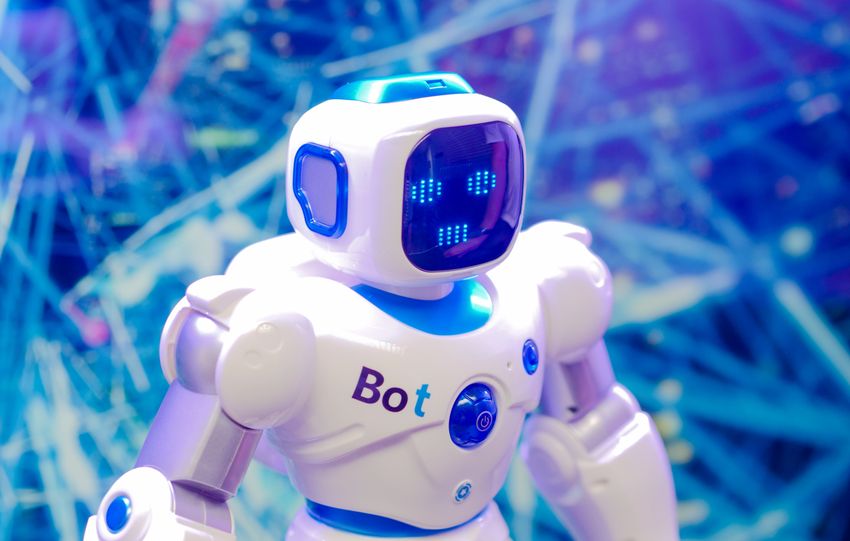 High-tech humanoid robot with LED face display, showcasing modern robotics and innovation.