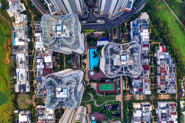 Stunning aerial view of Jakarta's unique architecture with high-rise buildings and lush surroundings.
