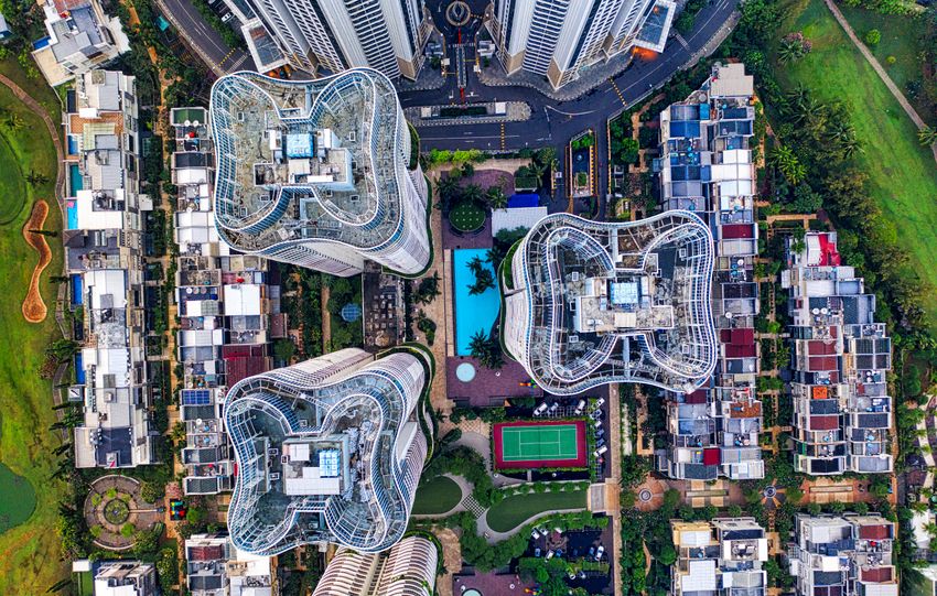 Stunning aerial view of Jakarta's unique architecture with high-rise buildings and lush surroundings.